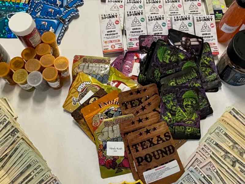A photo showing various packets that allegedly contain illegal cannabis product.