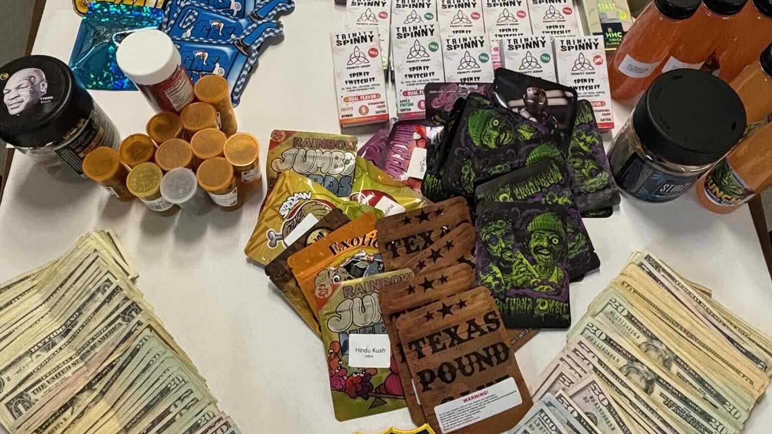 A photo showing various packets that allegedly contain illegal cannabis product.