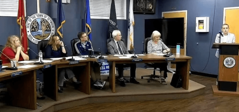The Seymour Board of Selectpersons listen to a member of the public speak.